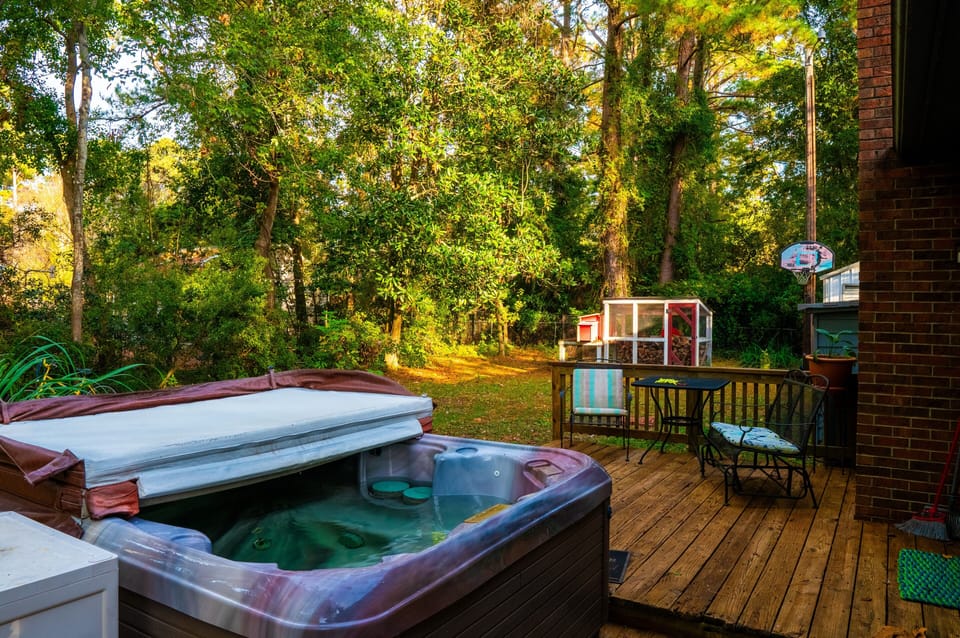 Hot tub, deck, fire pit, goal, custom chicken coop now firewood storage!