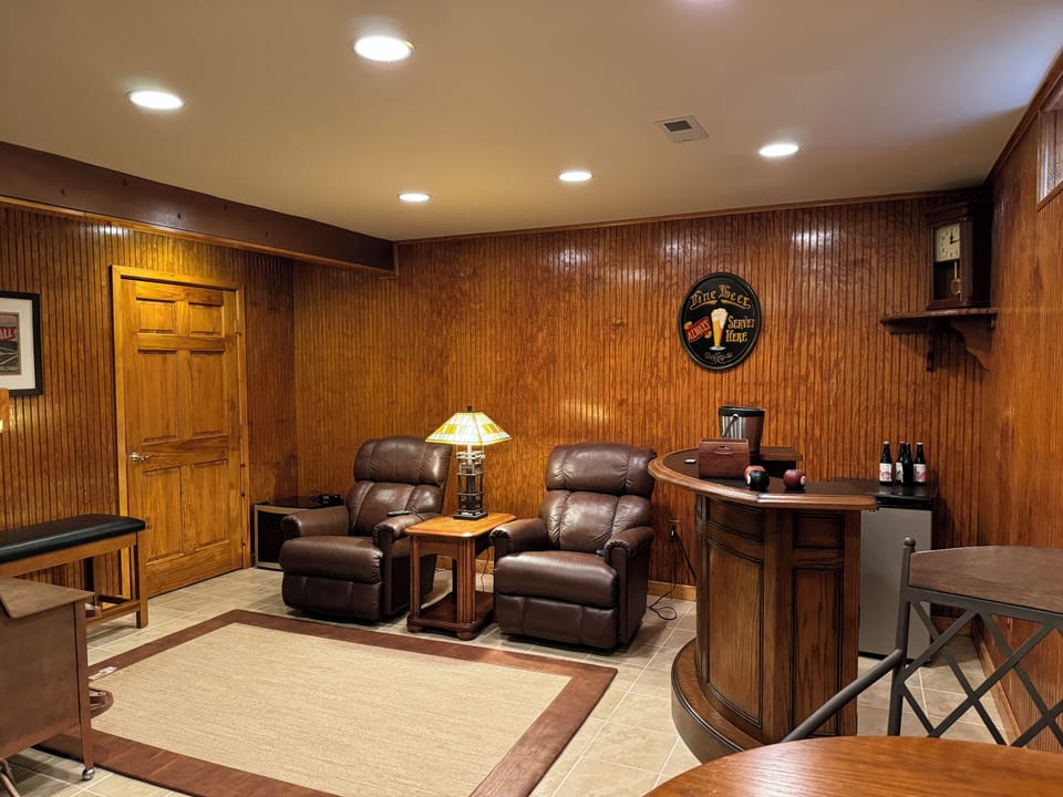Lounge seating off game room with bar area