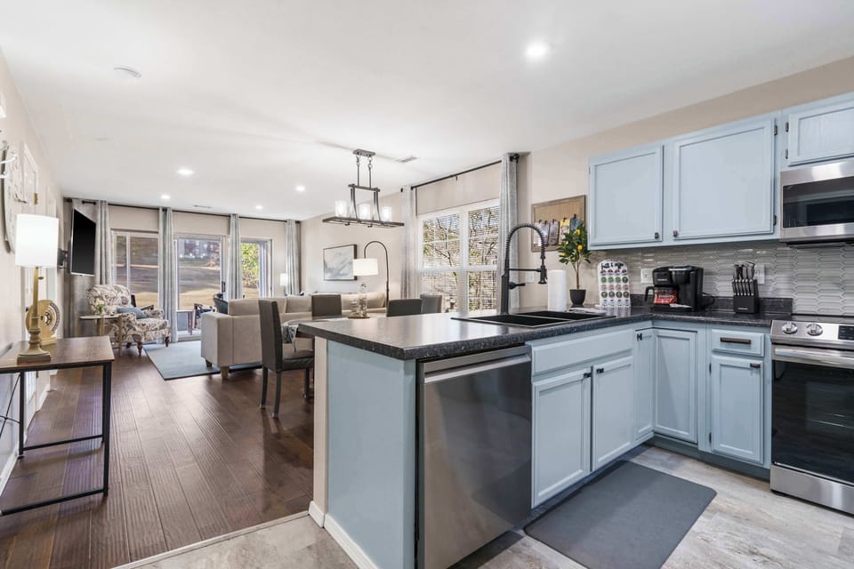 The open, airy kitchen offers ample space & all the comforts of home