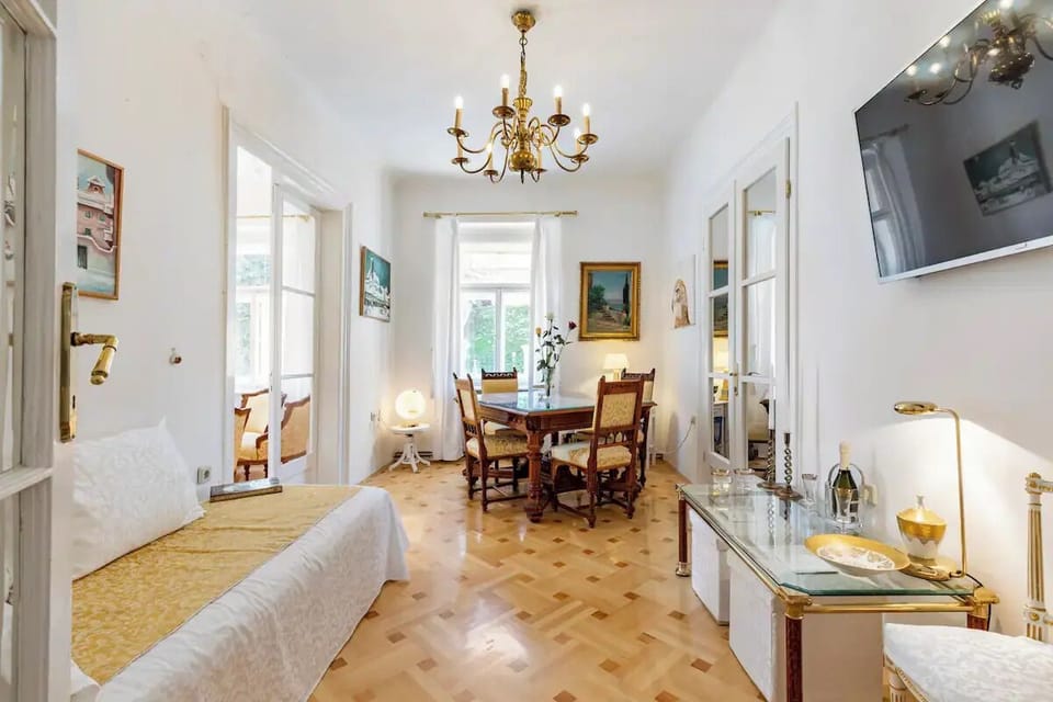 This is a living room with a big table for eating, studying, working...