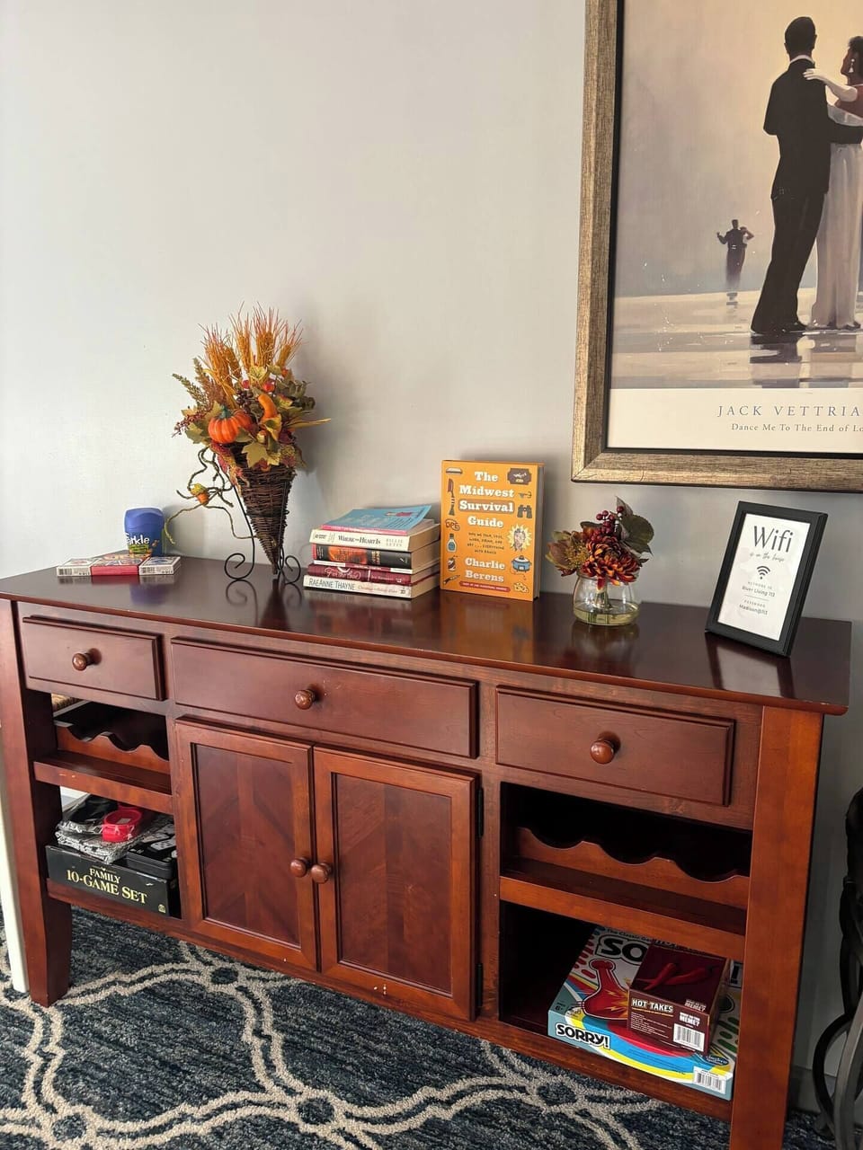 Living Room hutch stocked with board games and books