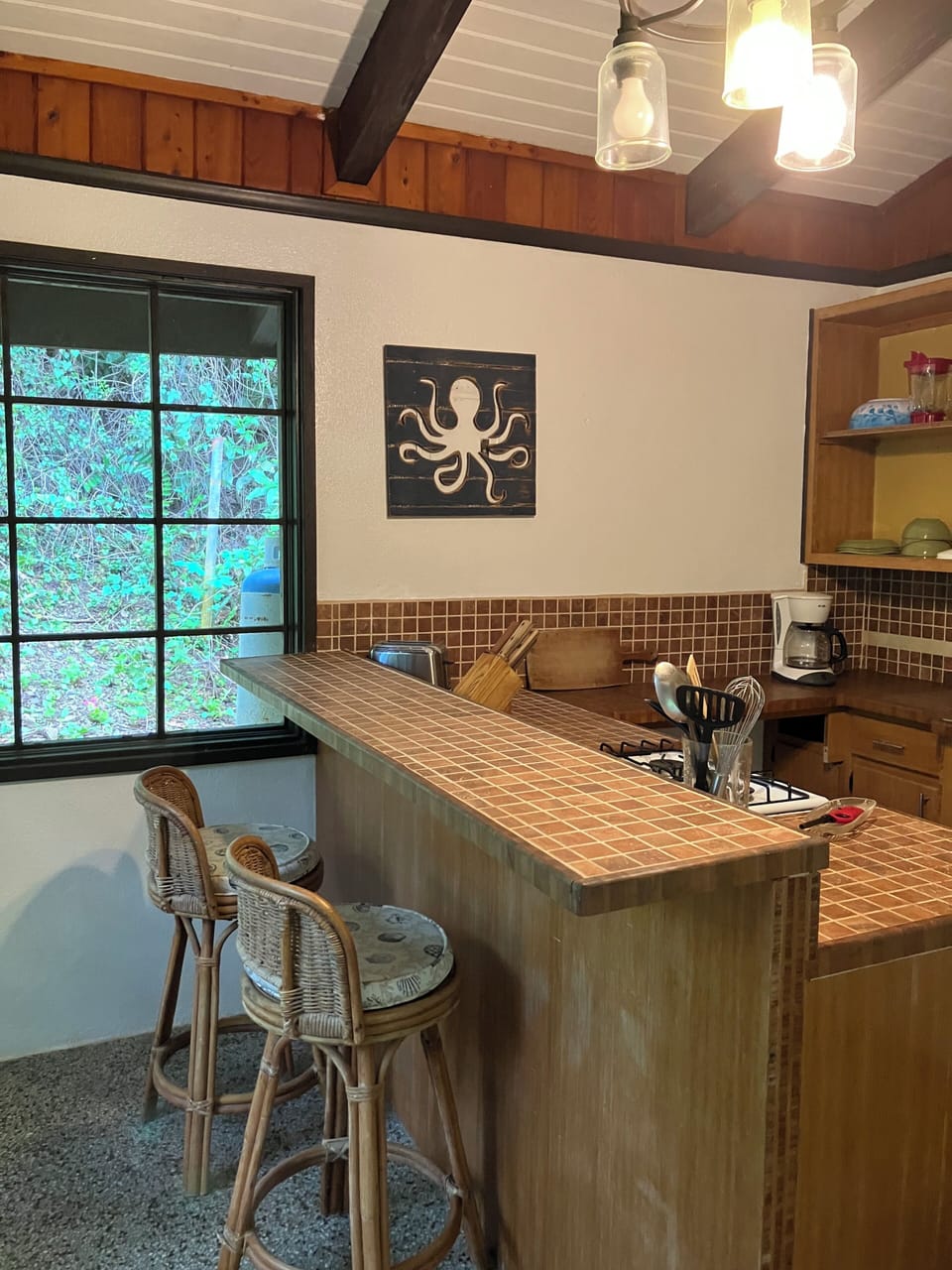 The kitchen island provides added space for cooking, eating or entertaining.