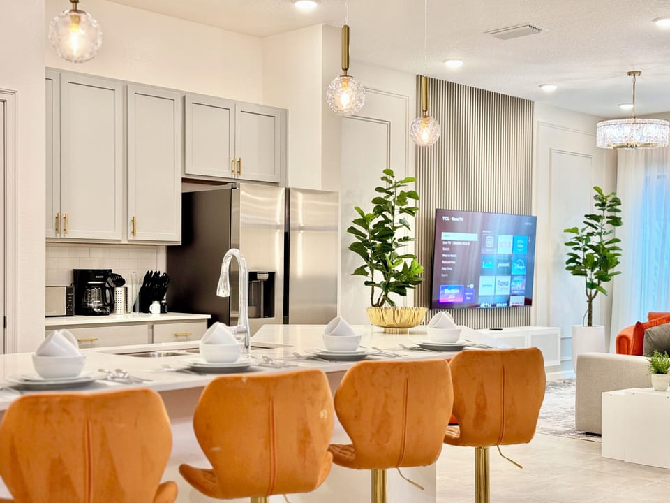 kitchen countertop with comfortable benches integrated into the living room.