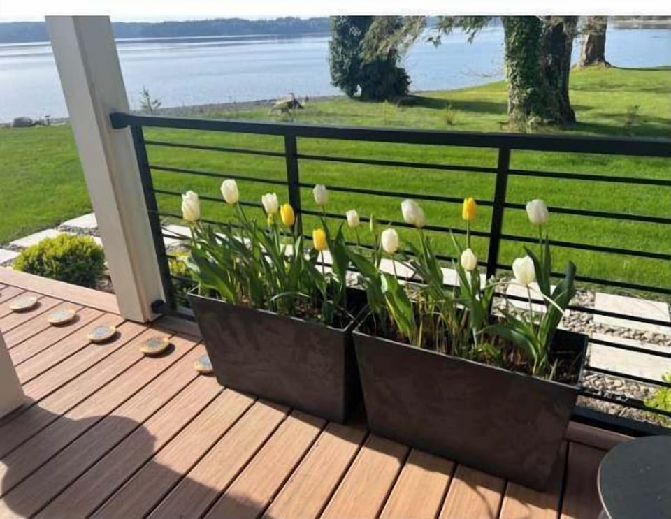 Sip your morning coffee surrounded by fresh blooms and breathtaking waterfront views.