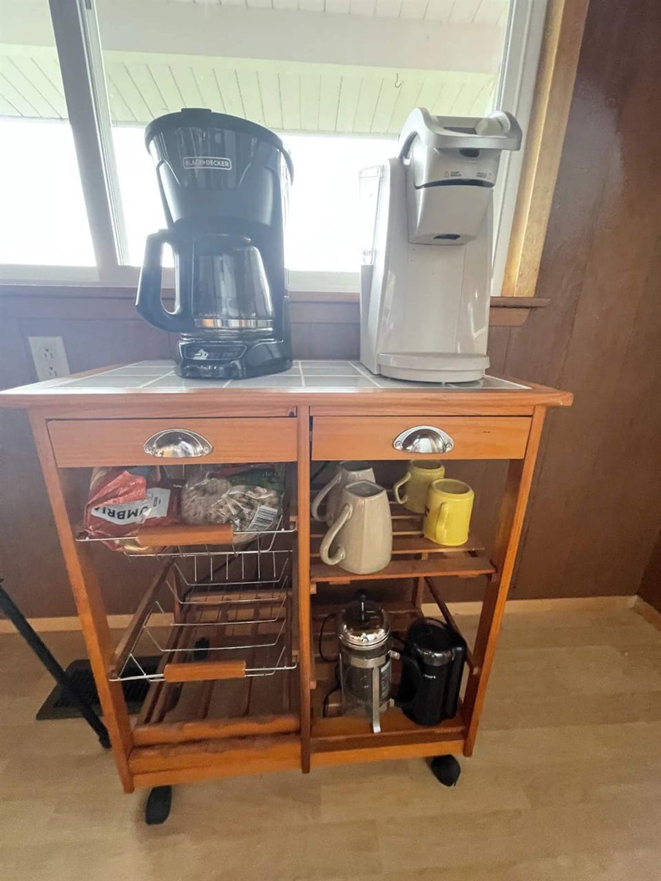 Coffee bliss awaits in our cozy coffee nook, featuring a coffee maker and a French press, along with complimentary coffee and tea for a perfect morning pick-me-up.
