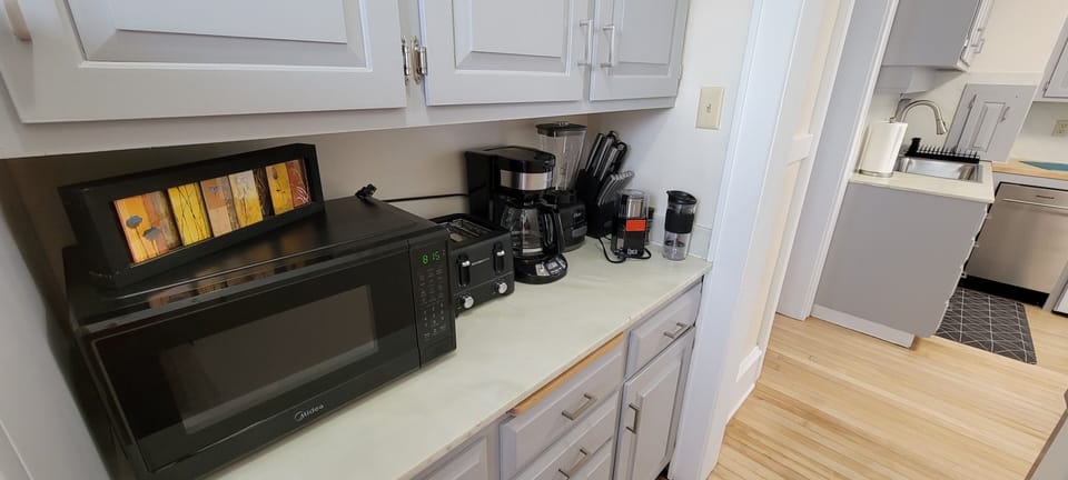 Fully stocked with microwave, coffee maker, toaster, blender, pots, pans, etc.