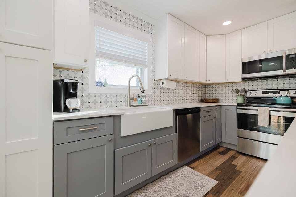 The spacious kitchen features granite countertops, modern appliances, and everything needed to prepare meals during your stay.