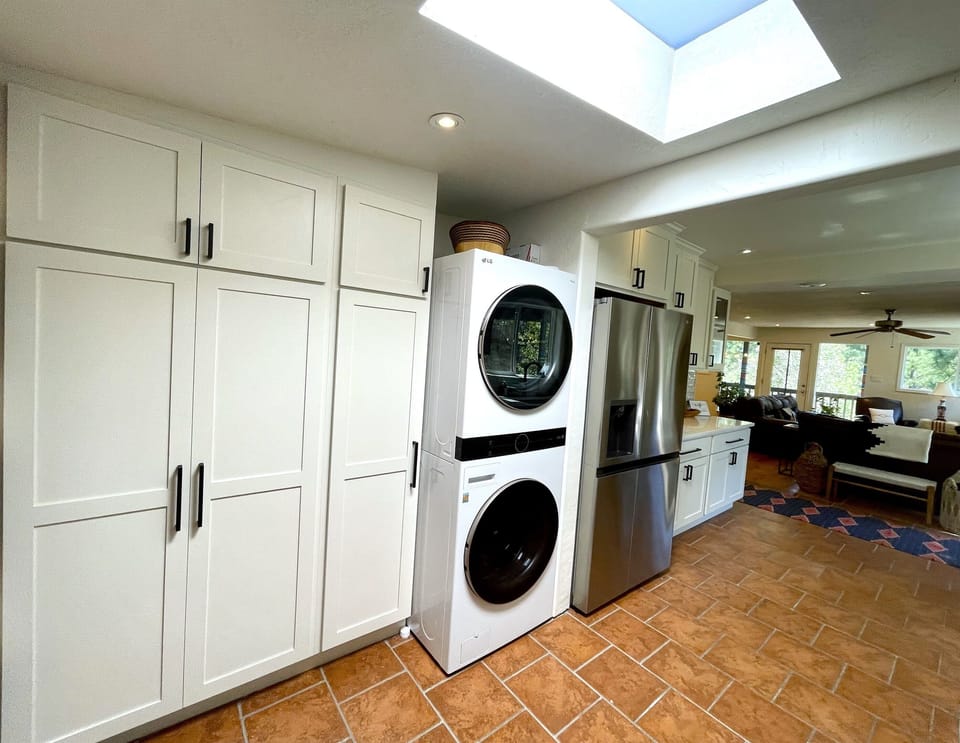Pantry, washer and dryer and fridge with ice maker