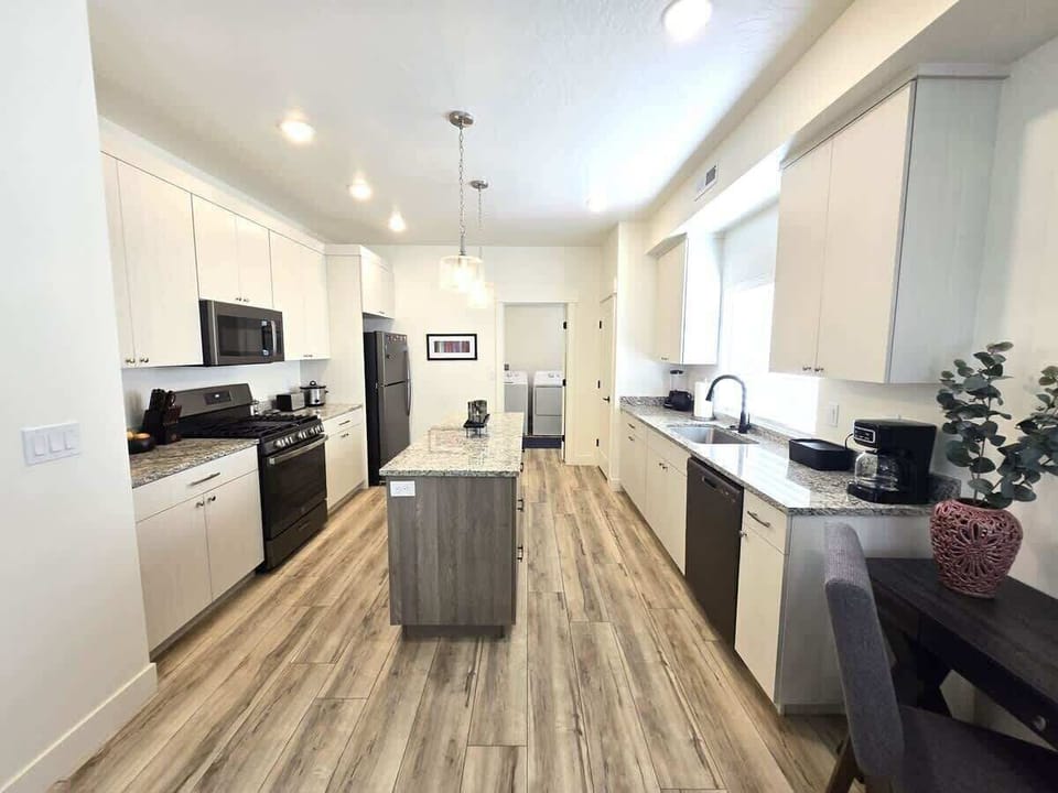 Large kitchen with plenty of cupboards and large island