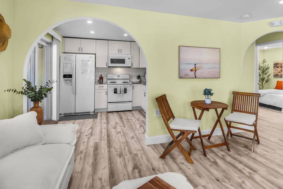 The lovely, updated living area at La Casa de la Playa combines stylish décor with comfortable furnishings, creating a welcoming space to relax.