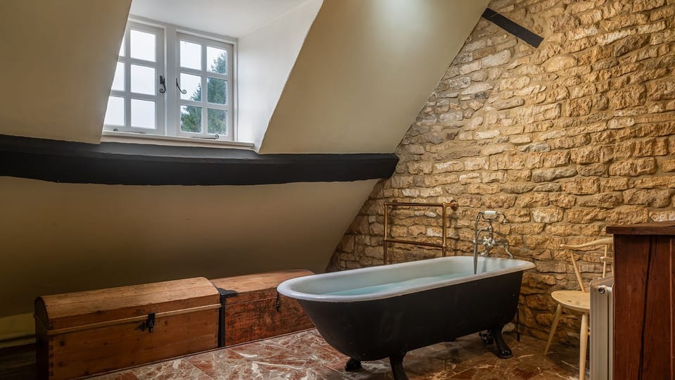 At the top of the house sits the en-suite to bedroom one