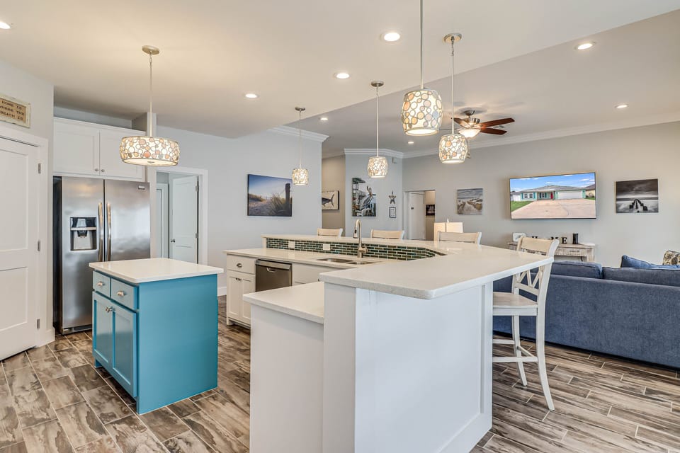 Your spacious kitchen island becomes the heart of your stay, perfect for cooking meals and casual dining together.