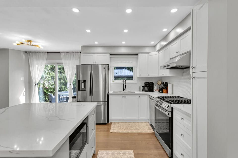 Elegant kitchen with all the essentials for cooking and dining.