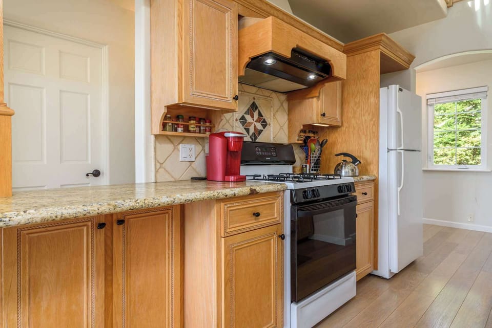 The open, airy kitchen offers ample space & every home comfort
