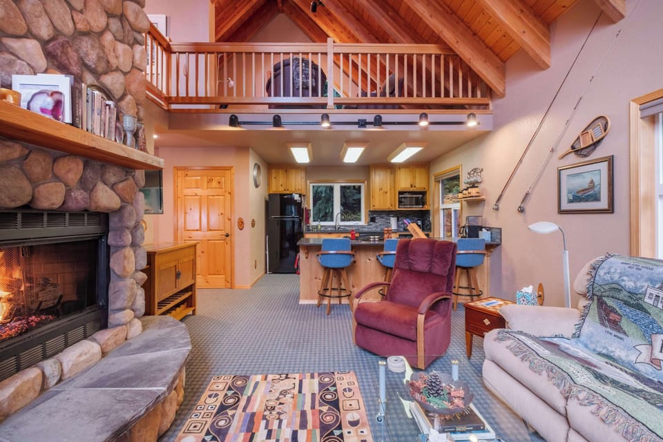 With a firepit as the centerpiece, this living room offers a warm, inviting space for relaxation and conversation.