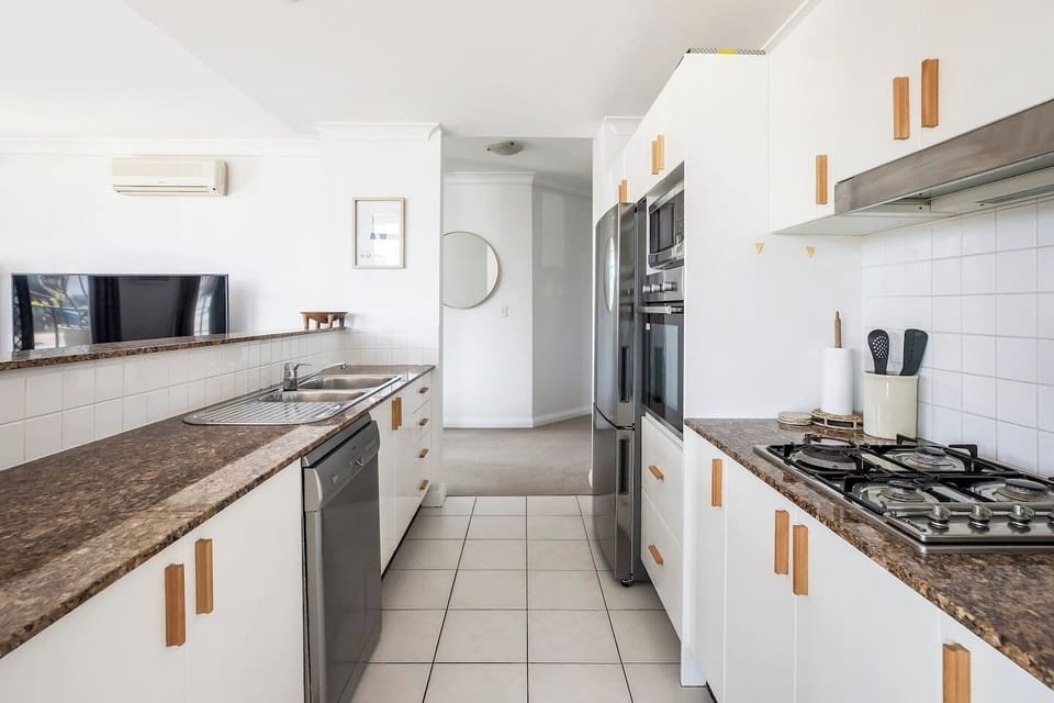 A fully equipped kitchen has all you need to cook meals when you’re not cafe-hopping, plus a dishwasher for easy clean-up. 
