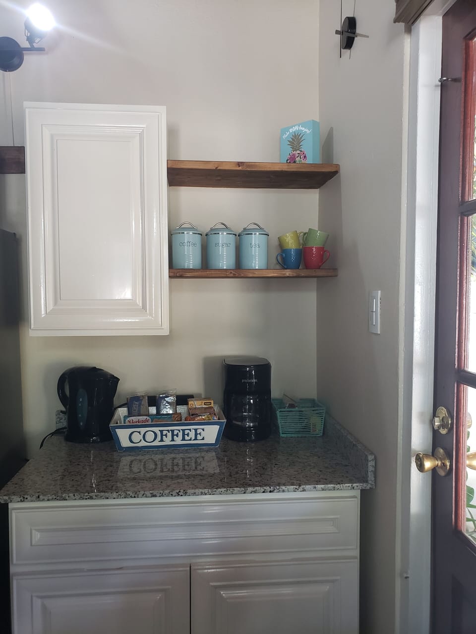 Coffee Bar stocked with coffee, teas, sugar and cream and some on the go snacks.