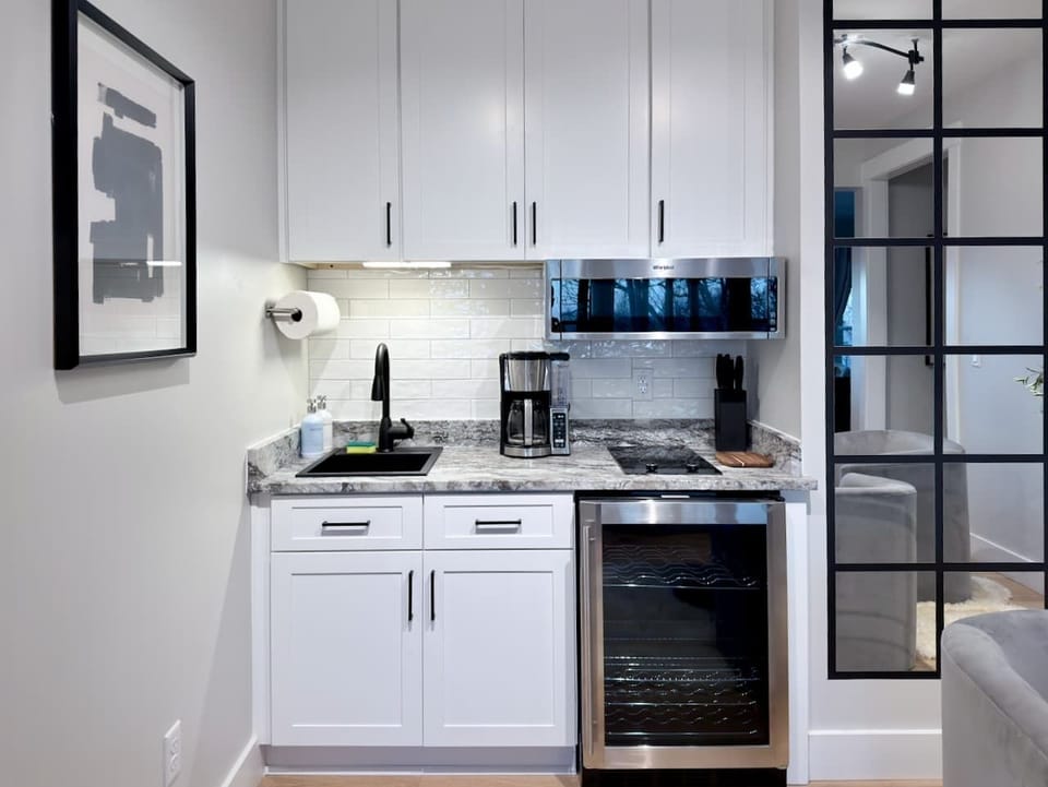 Lower Level Kitchenette - Perfect for groups and extra comfort, our lower-level kitchenette is fully stocked for easy snacks, drinks, and quick meals,so you don’t have to run upstairs every time you want a coffee refill or a late-night bite. 