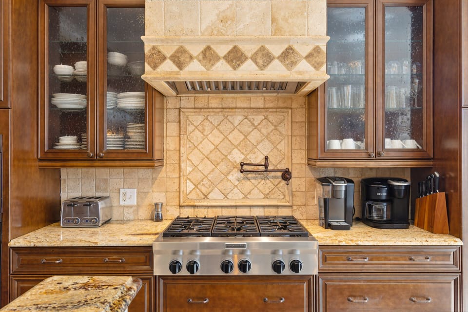 A fully-equipped kitchen is ready to handle casual meals and holiday feasts alike. With top-of-the-shelf appliances like 6-burner gas range and double oven it will be a breeze!