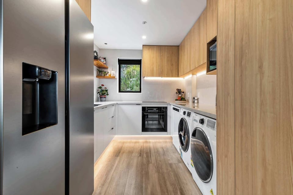Bright, modern kitchen complete with appliances and stylish decor!