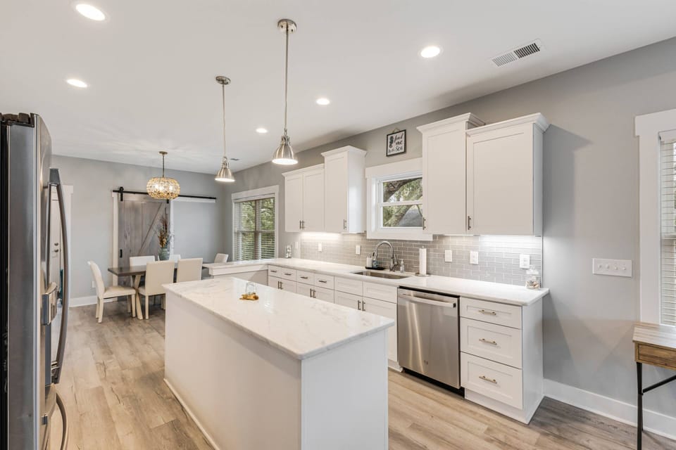 Cook up a storm in our modern kitchen with sleek appliances and convenient dining space!
