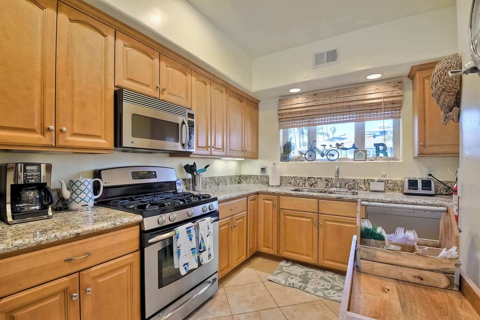 The open, airy kitchen offers ample space & every home comfort