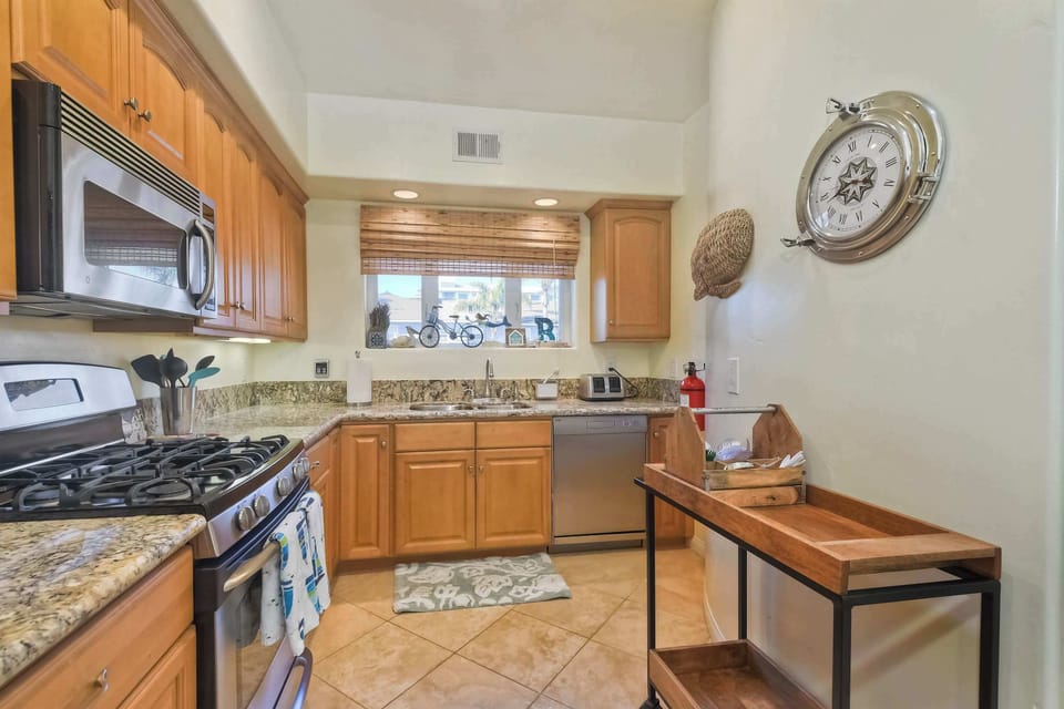 The open, airy kitchen offers ample space & every home comfort