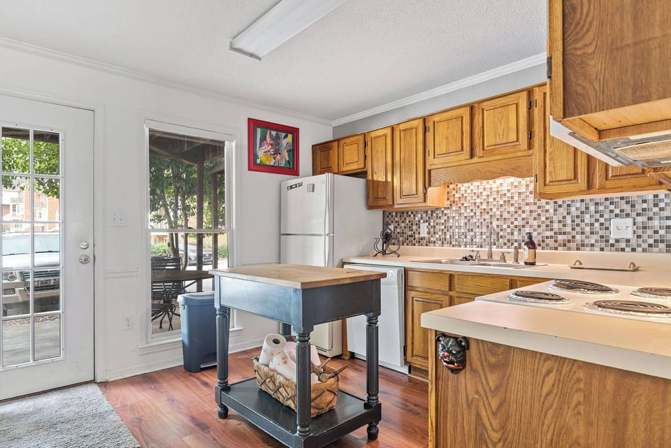 Well-equipped, comfortable kitchen filled with natural light