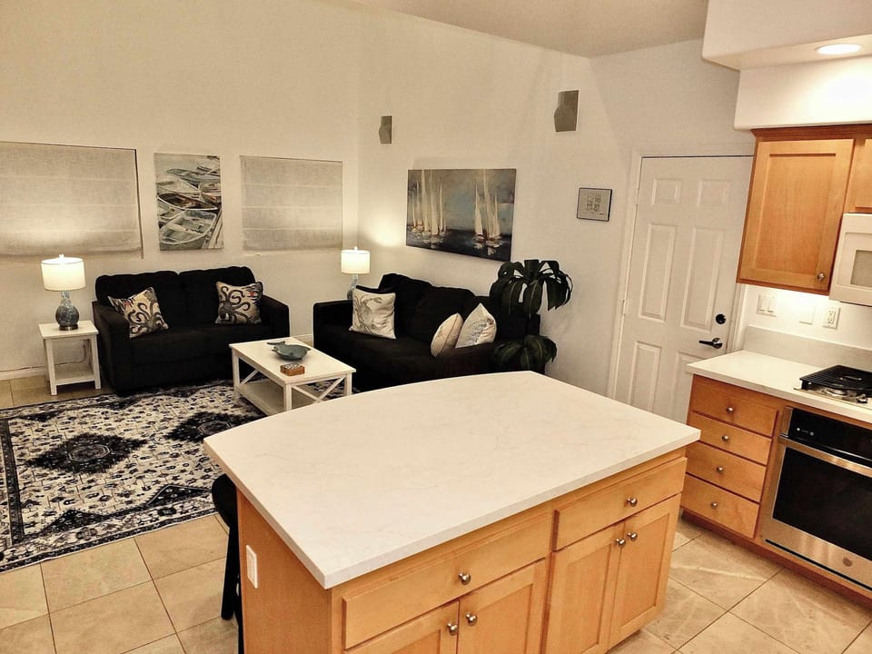 The open, airy kitchen has ample space and all the comforts of home