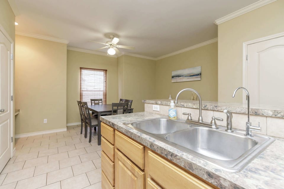 The breezy, open kitchen offers loads of space & all the comforts of home