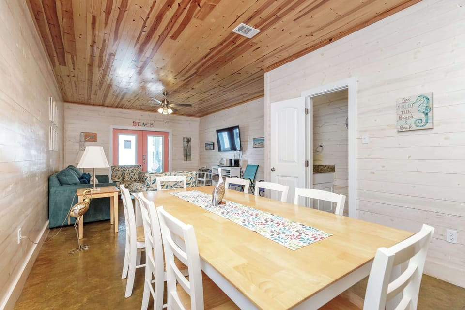 Gather for meals at the dining table, offering seating for 8