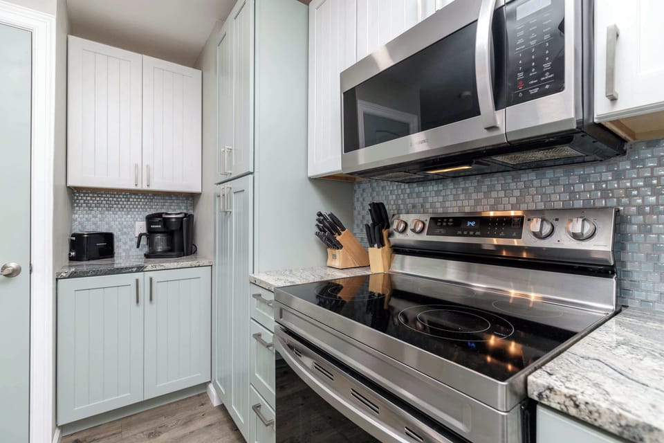 The updated, beachy kitchen offers ample space & all the comforts of home