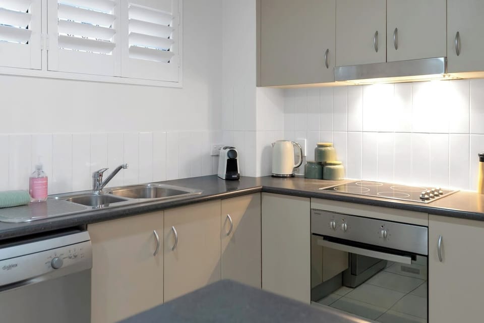 Fully equipped kitchen with modern appliances and everything you need to prepare meals, including a Nespresso machine for your morning coffee.
