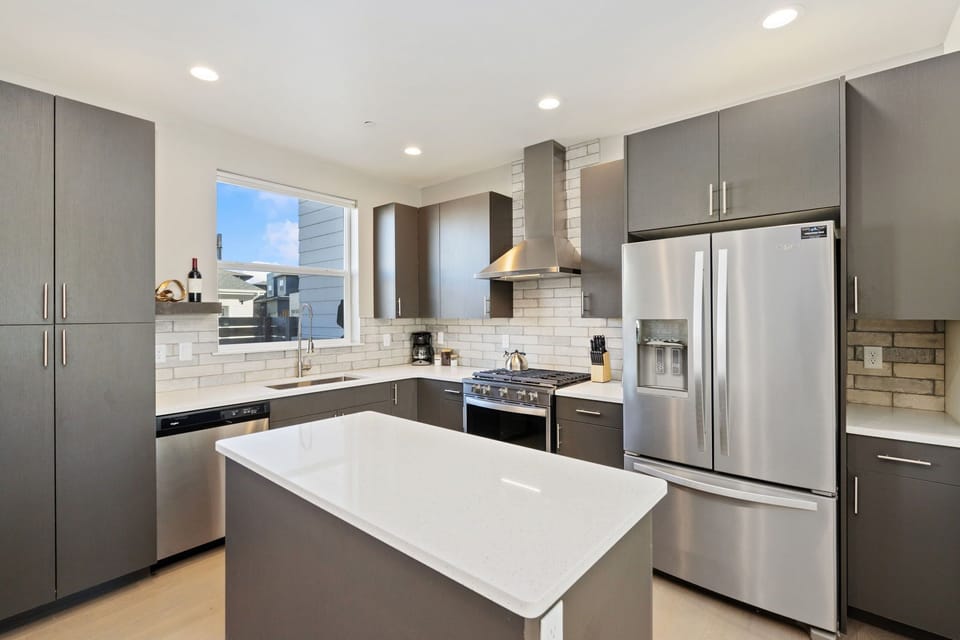 Chef's Kitchen with Island | Easy access to main level grilling patio!