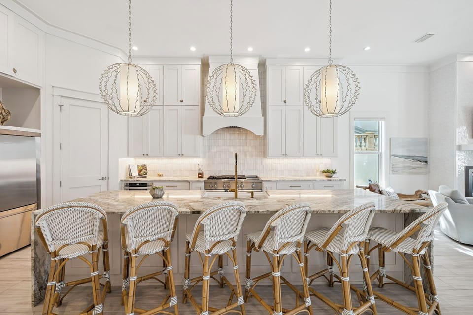 Your dream kitchen awaits with marble island seating, elegant pendant lighting, and premium appliances perfect for memorable meals.