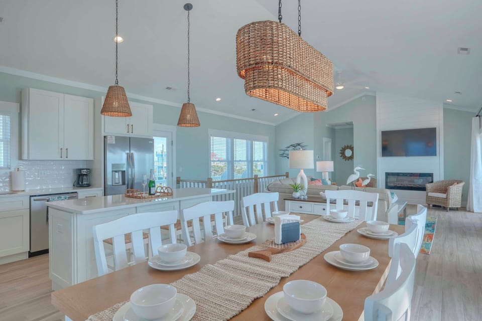 Top floor kitchen, dining, living and powder rooms, elec fireplace and large TV