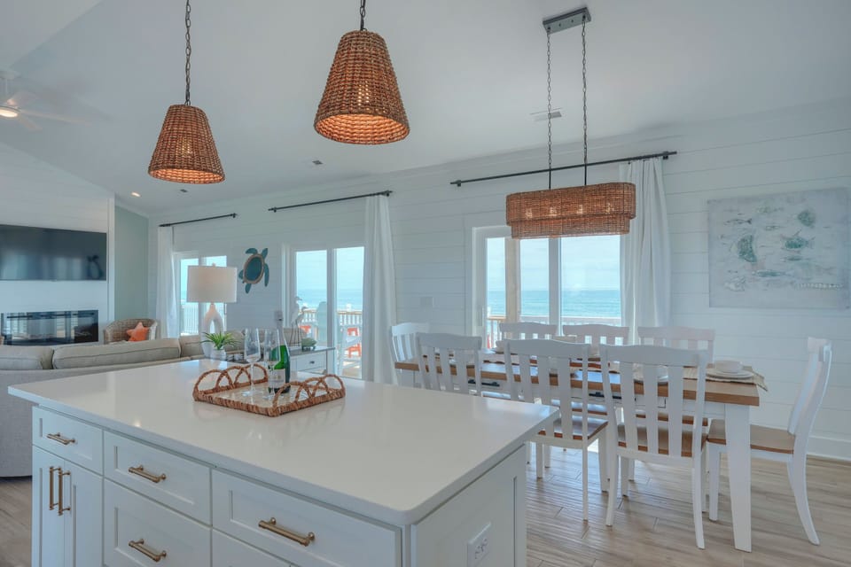 Large kitchen and dining area. Sliders to decks