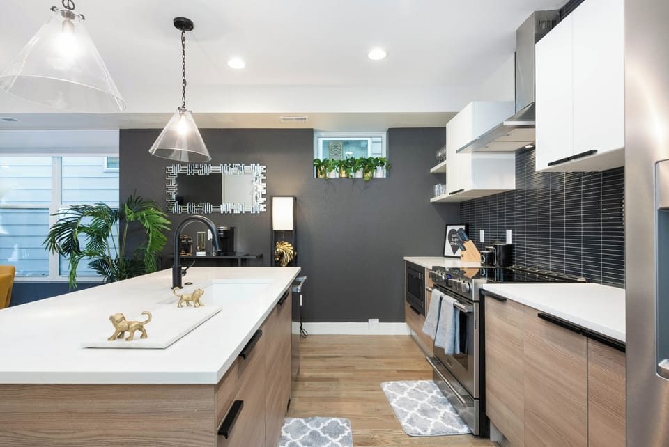 Large Kitchen with electric 6-burner stove, dishwasher, island, and coffee bar