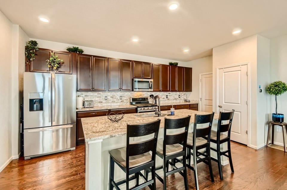 Huge island for casual meals, plus large pantry and exit to garage