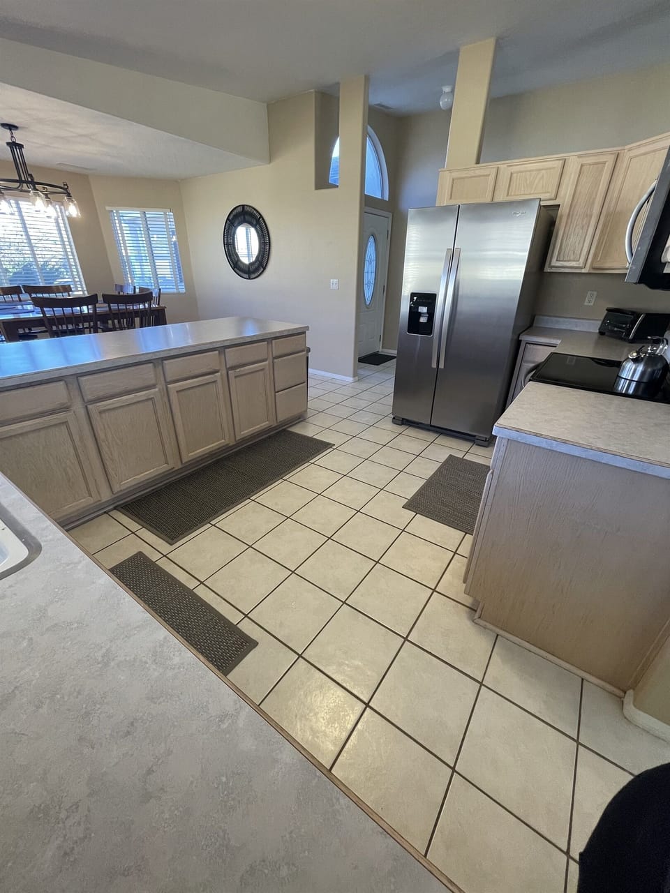 Cooking is a breeze in this fully equipped kitchen, featuring modern appliances and ample counter space.