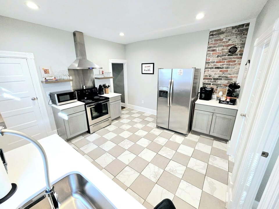 Large open kitchen with stainless steel appliances and all the essentials