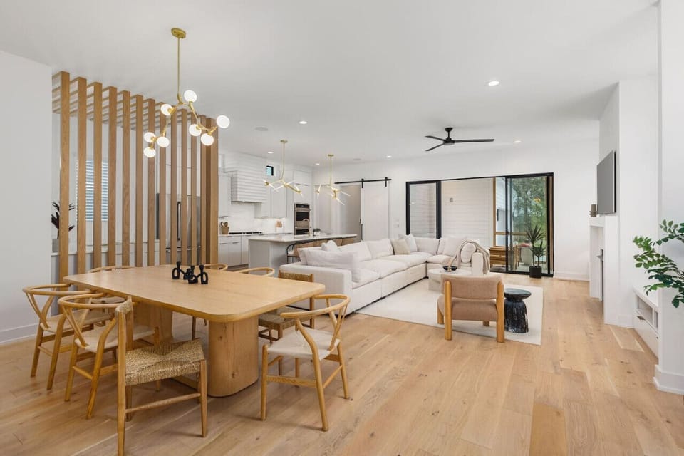 Spacious living room with lots of natural light and comfortable seating for your group. Dining room table that can seat 8 people for a delicious meal.
