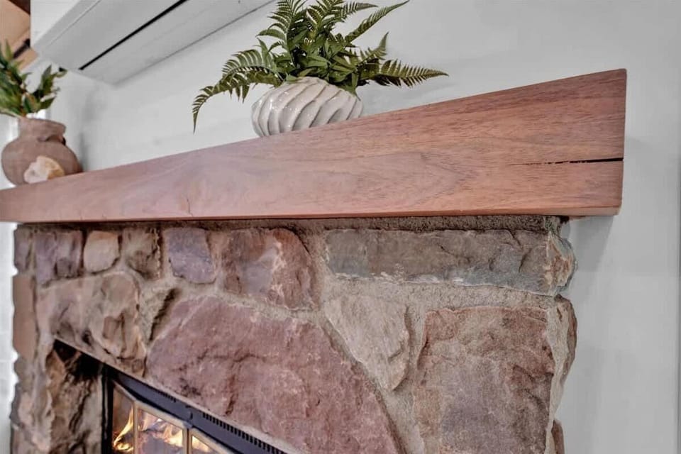 Stunning Stone Fireplace Detail with Wood Mantel