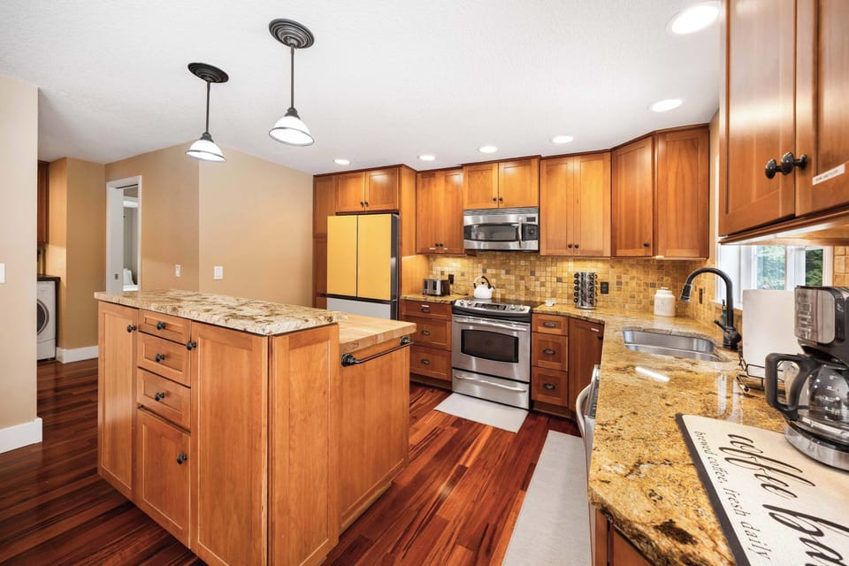 Modern kitchen with granite countertops and state-of-the-art appliances, ready to handle any culinary challenge.