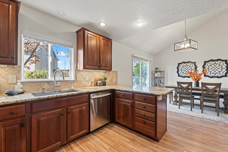 Whip up your favorite meals in this fully equipped kitchen with a bar for extra seating, all while staying connected to the dining area for easy meals and good conversation.