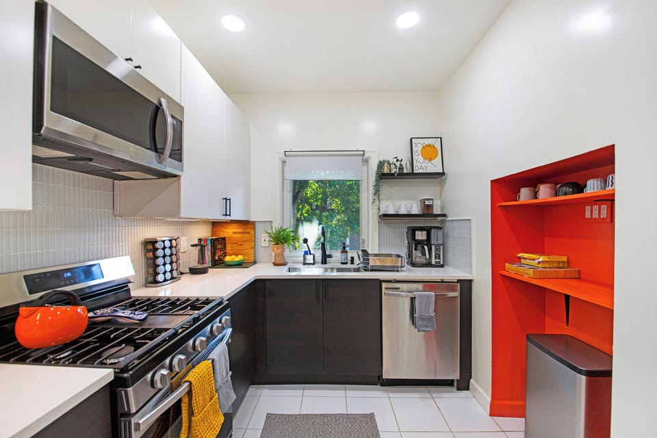 View of the fully stocked kitchen large enough to prepare family dinners