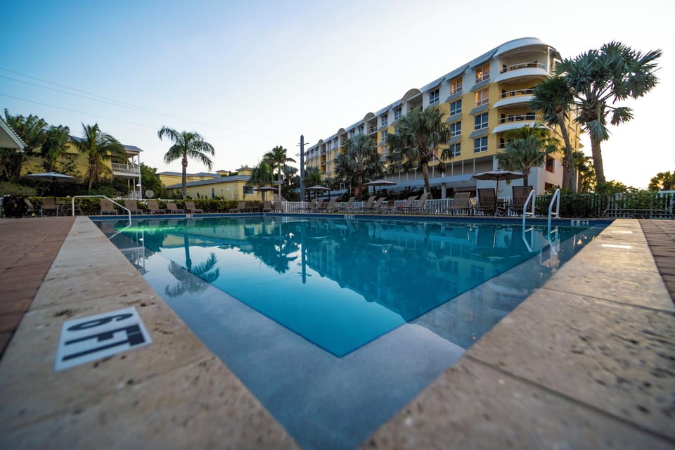Outdoor pool with showers and bathrooms. Building in background not associated.