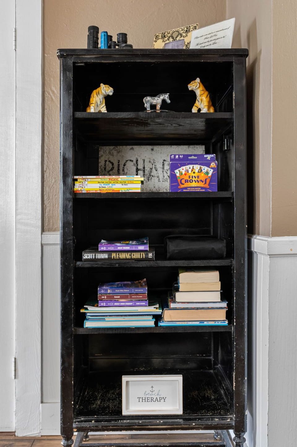 The room is also adorned with thoughtfully curated décor, from framed artwork to subtle greenery, adding layers of personality and style without overwhelming the serene vibe.