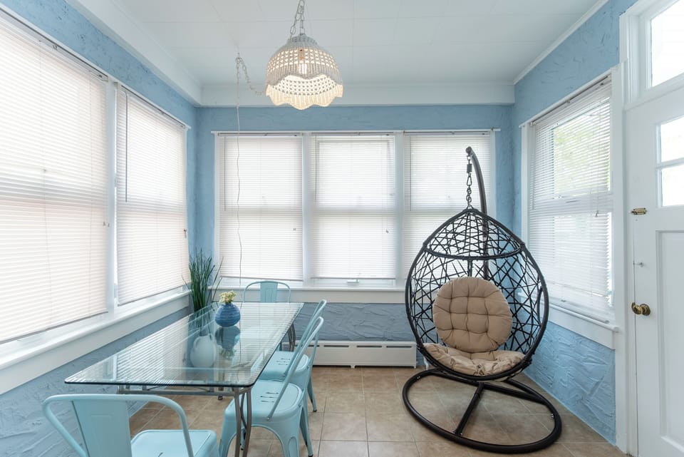 The sun room is a great place to relax with a book or break out a board game