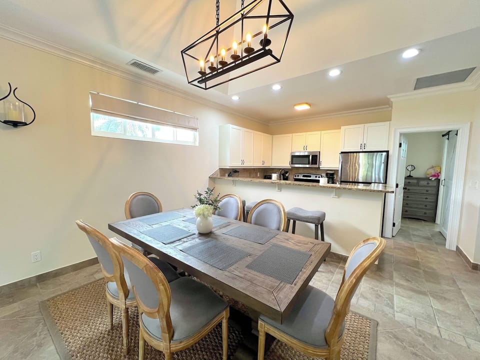 Seating for six at the dining table, plus additional room at the breakfast bar